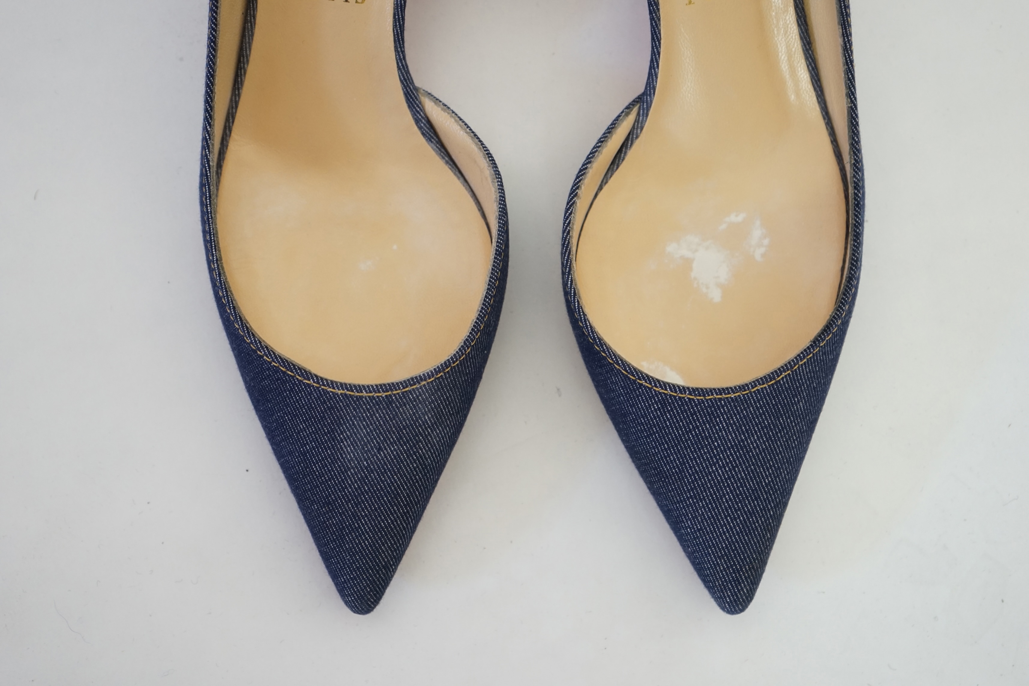 A pair of Christian Louboutin lady's denim pumps with wooden heels, comes with dust bag in original box. Size 39. Proceeds to Happy Paws Puppy Rescue